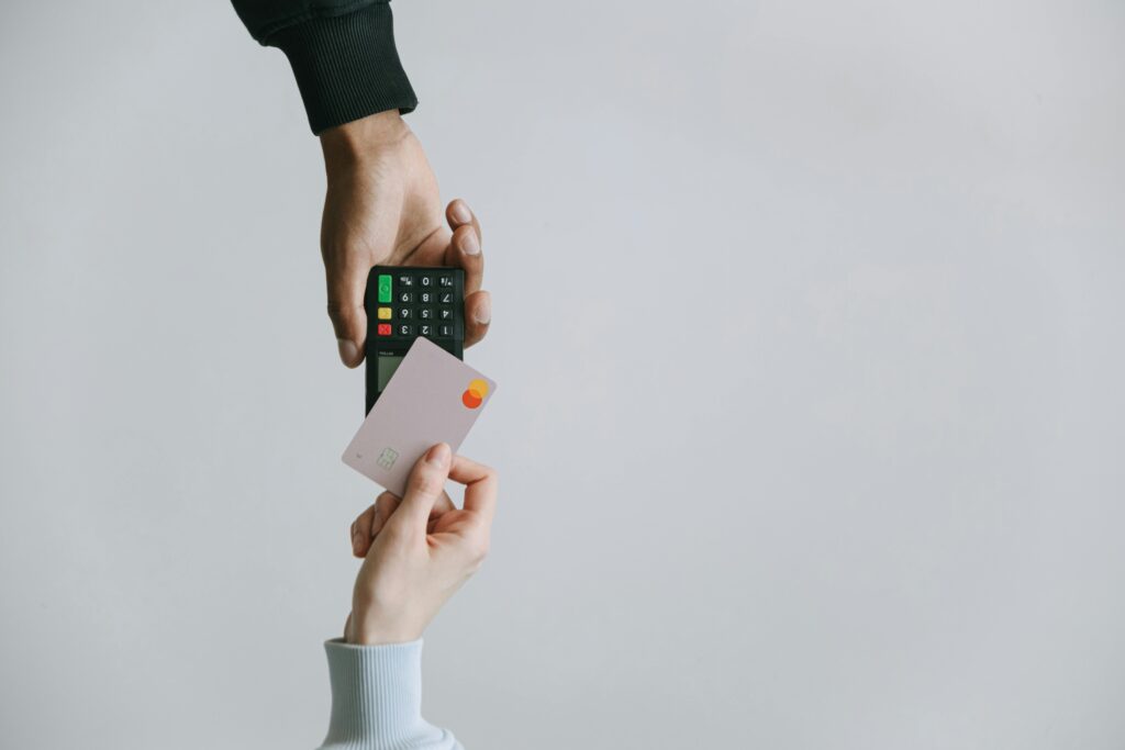 Modern contactless payment using a card and terminal, highlighting the ease of digital transactions.